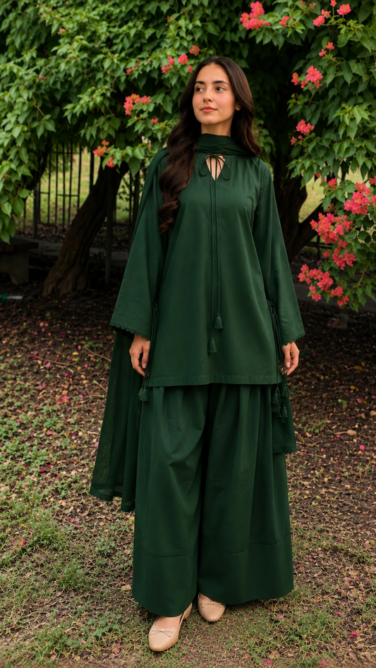 Bottle green 2-piece Pakistani suit with long flowy shirt and wide-leg shalwar