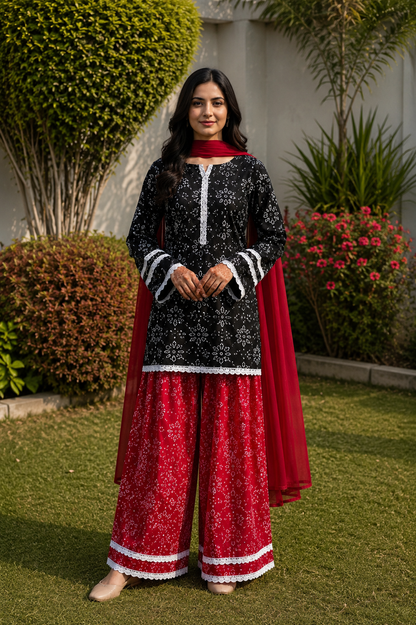 Black printed Pakistani shalwar suit with red traditional shalwar and chiffon dupatta for women by Noor by Nureh