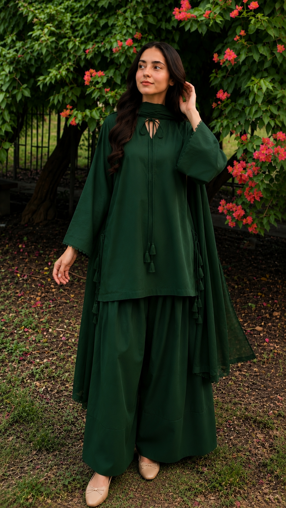 Bottle green 2-piece Pakistani suit with long flowy shirt and wide-leg shalwar