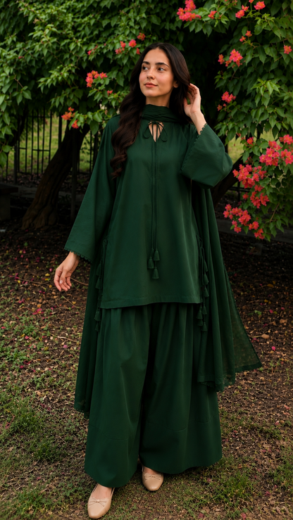Bottle green 2-piece Pakistani suit with long flowy shirt and wide-leg shalwar
