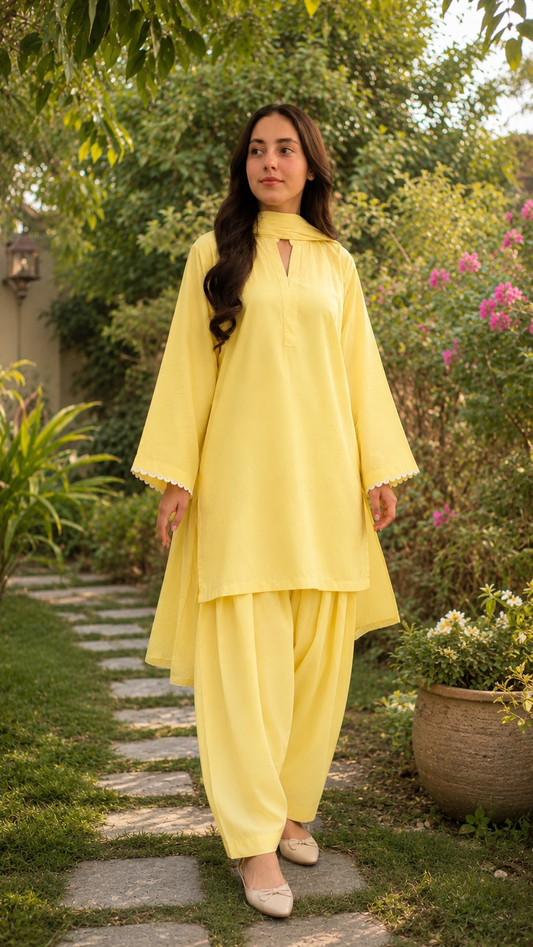 Pastel yellow 2-piece women’s suit with wide sleeves and scalloped detailing by Noor By Nureh