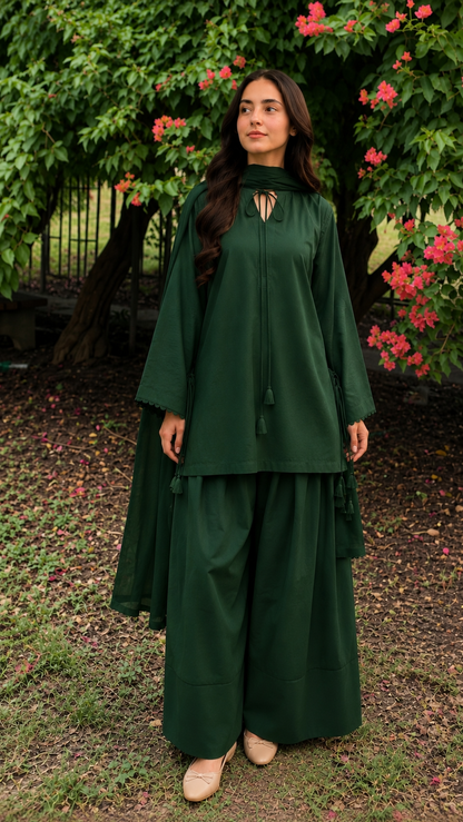 Bottle green 2-piece Pakistani suit with long flowy shirt and wide-leg shalwar