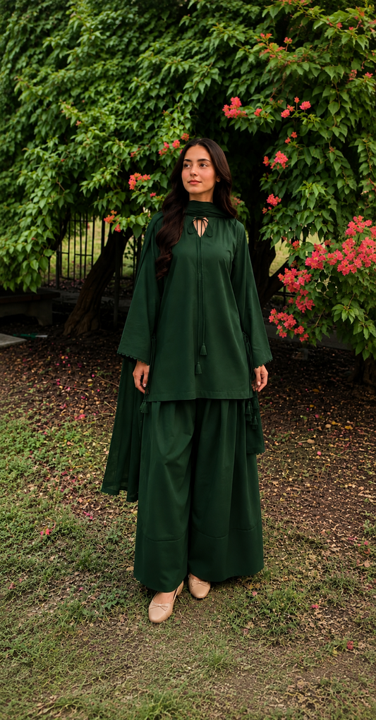 Bottle green 2-piece Pakistani suit with long flowy shirt and wide-leg shalwar
